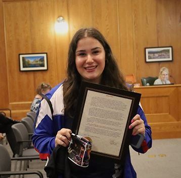 Woman holding proclamation 