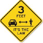 Sign showing that cars must stay 3 feet away from bikers - it's the law